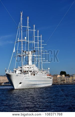 ST. PETERSBURG, RUSSIA - AUGUST 5, 2015: Cruise liner Wind Surf of Windstar Cruises Luxury Lines departs from the Neva river. The 5-masts ship provides luxury cruise for 310 guests