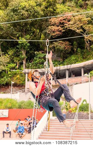 Guide Performs In Public A Climbing Rope Exercise