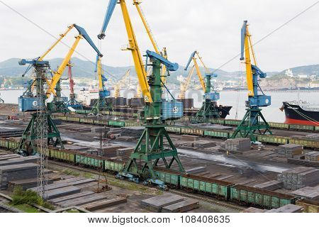 NAKHODKA, RUSSIA - CIRCA SEPTEMBER, 2015: Loading metal in cargo ship at the port of Nakhodka. It is the largest port in Russia, main export goods in port of Nakhodka are coal, oil, wood and metals