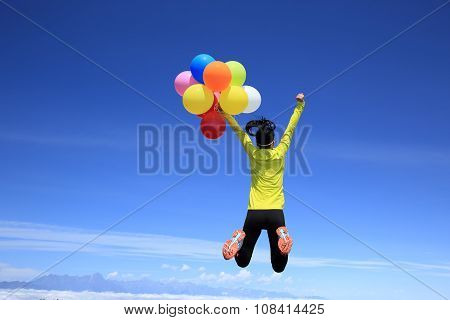 young woman with colorful balloons