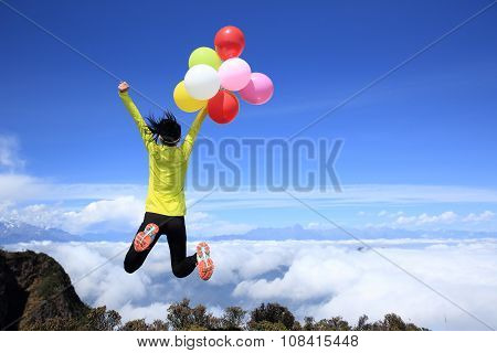young woman with colorful balloons