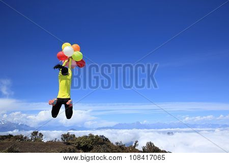 young woman with colorful balloons