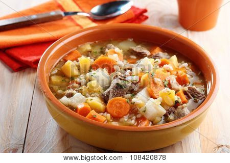 Irish coddle in a rustic bowl closeup