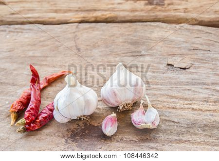 Garlic And Dry Chili On Wooden Background