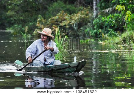 Local Fisherman In The Amazon Rainforest, Manaos, Brazil