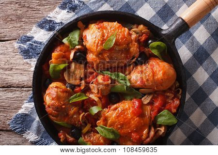 Cacciatori Chicken With Black Olives Close-up In A Pan. Horizontal Top View