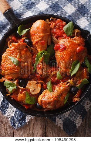 Cacciatori Chicken With Mushrooms Closeup In A Pan. Vertical Top View