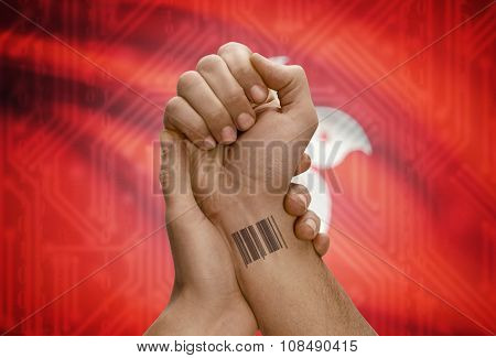 Barcode Id Number On Wrist Of Dark Skinned Person And National Flag On Background - Hong Kong
