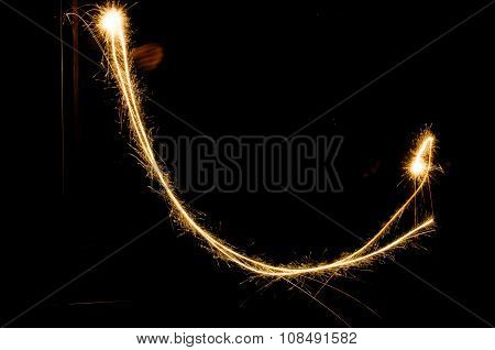 sparkler light trail in dark environment using slow shutter speed