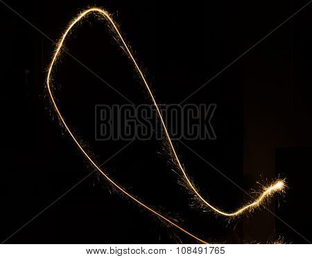 sparkler light trail in dark environment using slow shutter speed