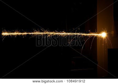 sparkler light trail in dark environment using slow shutter speed