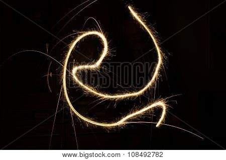 sparkler light trail in a dark environment using slow shutter speed