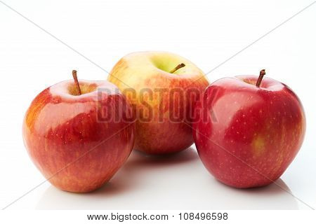 Three red apples