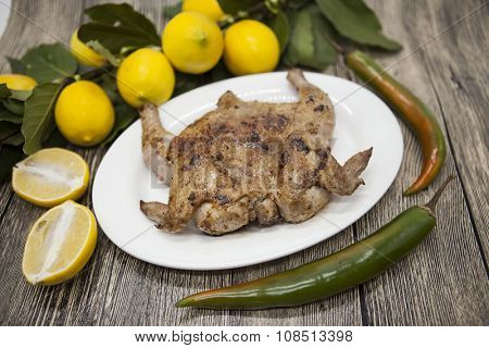 Three fresh raw chicken on a wooden tray with chii  on the wooden background.