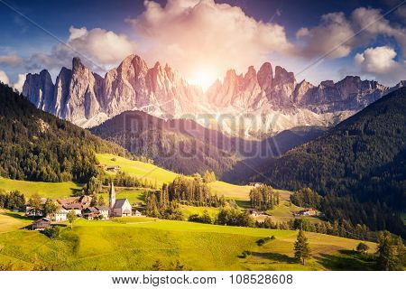 Countryside view of the Funes valley St. Magdalena or Santa Maddalena in the National park Puez Odle or Geisler. Dolomites, South Tyrol. Location Bolzano, Italy, Europe. Dramatic scene. Beauty world.