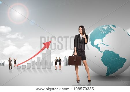 Buisnesspeople with growth graph and earth