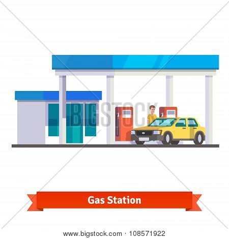 Gas station with man fuelling car