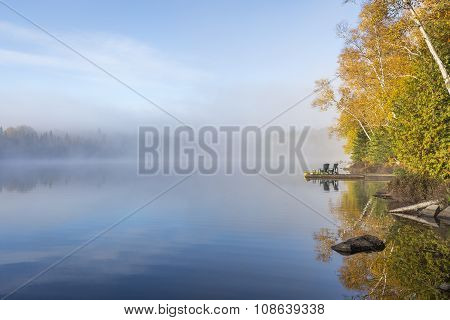 Misty Morning On A Lake In Autumn