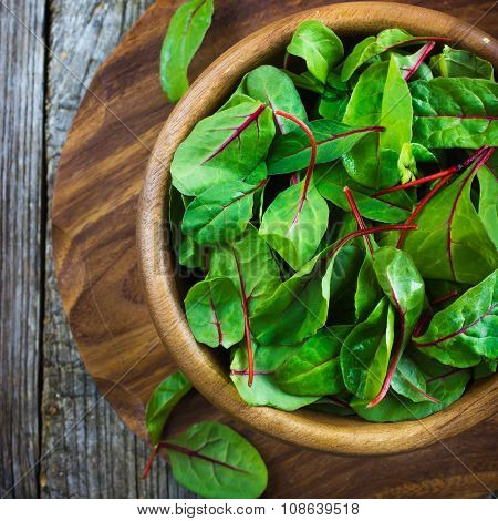 Fresh Chard Leaves In Wooden Bowl