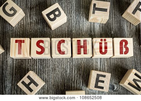 Wooden Blocks with the text: Bye (in German)