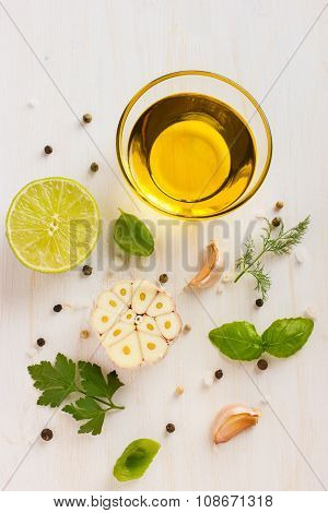 Ingrediets For Salad Dressing. Olive Oil, Garlic, Lemon, Herbs And Spices
