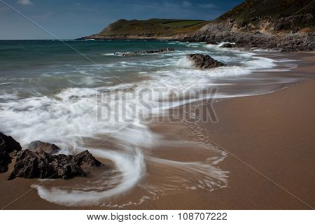 Swirling waves at Fall Bay Gower Swansea