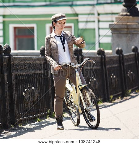 Young Woman At Vintage Bicycle British Style