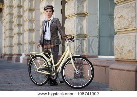 Young Woman At Vintage Bicycle British Style