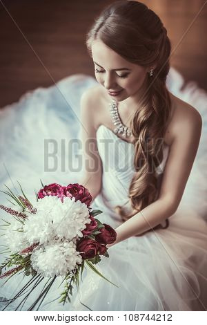 Beautiful bride with stylish make-up in white dress