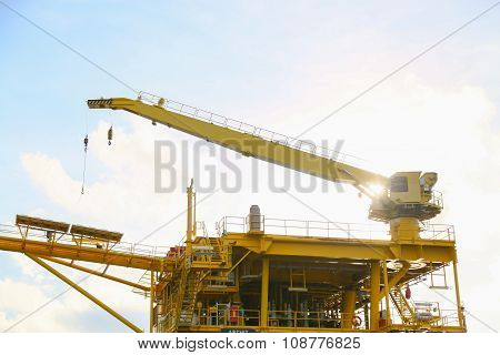 Crane operation transfer cargo on the platform and moving cargo from supply boat