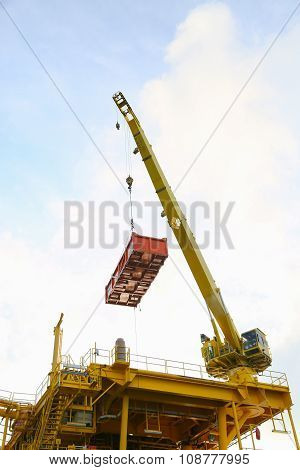 Crane operation transfer cargo on the platform and moving cargo from supply boat