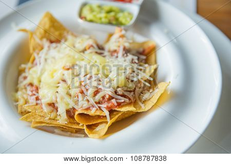 Mexican Food Nachos With Sauce And Cheese