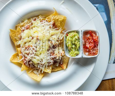 Mexican Food Nachos With Sauce And Cheese
