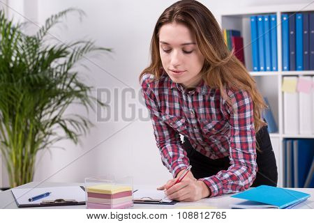 Young Employee Checking The List