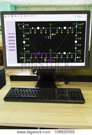 Computers and monitors with schematic diagram for supervisory, control and data acquisition