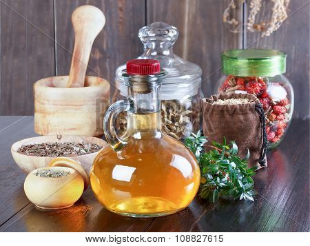 Therapeutic Herbal Tincture, Alternative Medicine, Love Potions, Dried Herbs On A Wooden Table.
