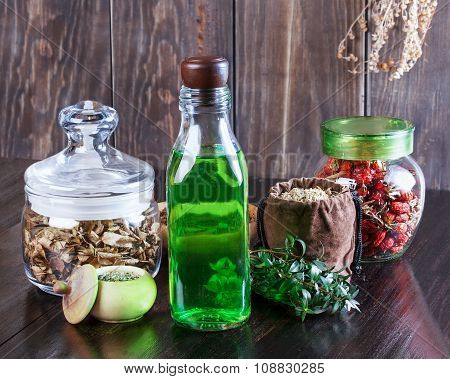 Therapeutic Herbal Tincture, Alternative Medicine, Love Potions, Dried Herbs On A Wooden Table.
