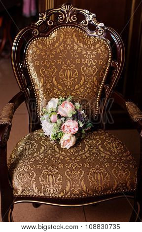 Beautiful wedding bouquet on an antique chair