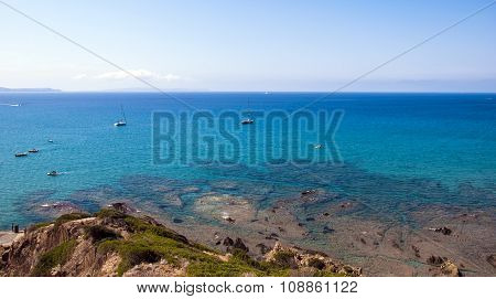 Summer Day In Sardinian Coast With Rocks A Blue Wounderful Sea And A Clear Sky