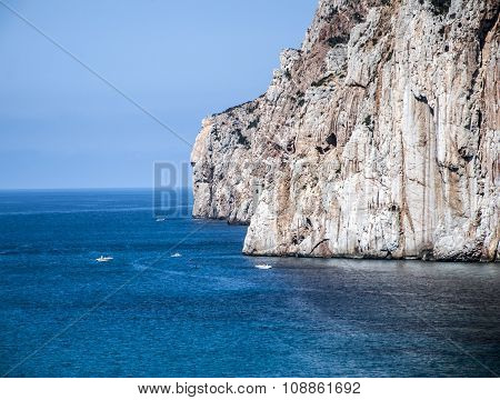 Masua's Sea Stack Daily And Some Boats In Summertime (sardinia-italy)