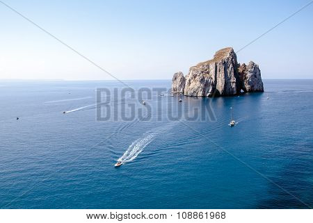 Pan Di Zucchero (nebida). A Rocky Island In The Center Of The Sea With Ships Sailing Around. Top Vie
