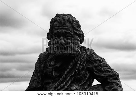 Lviv, Ukraine - November 15, 2015: Sculpture A Chimney Sweep On The Roof Of The House Of Legends On
