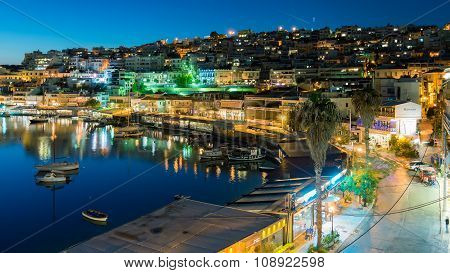 Athens, Greece 17 November 2015. Mikrolimano port in Peraeus against the city lights.