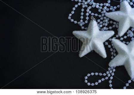 Three white stars and crystalline beads