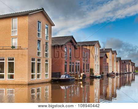 Modern Middle Class Houses Along A Canal