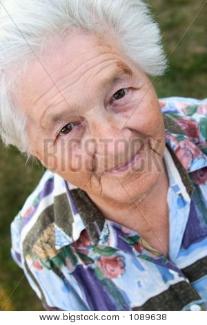 Elderly Looking Above And Smiling.