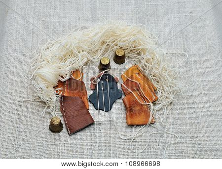 Set for a cobbler to sew moccasins.
