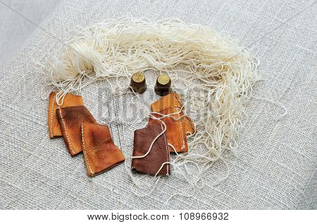 Set for a cobbler to sew moccasins.
