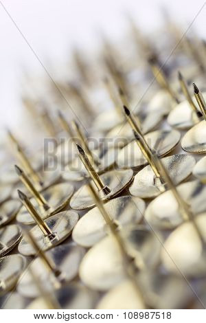 A Big Wall Of Thumbtacks In A White Box - Crooked Angle