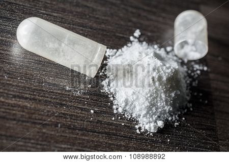 Macro Of An Opened White Medicine Capsule